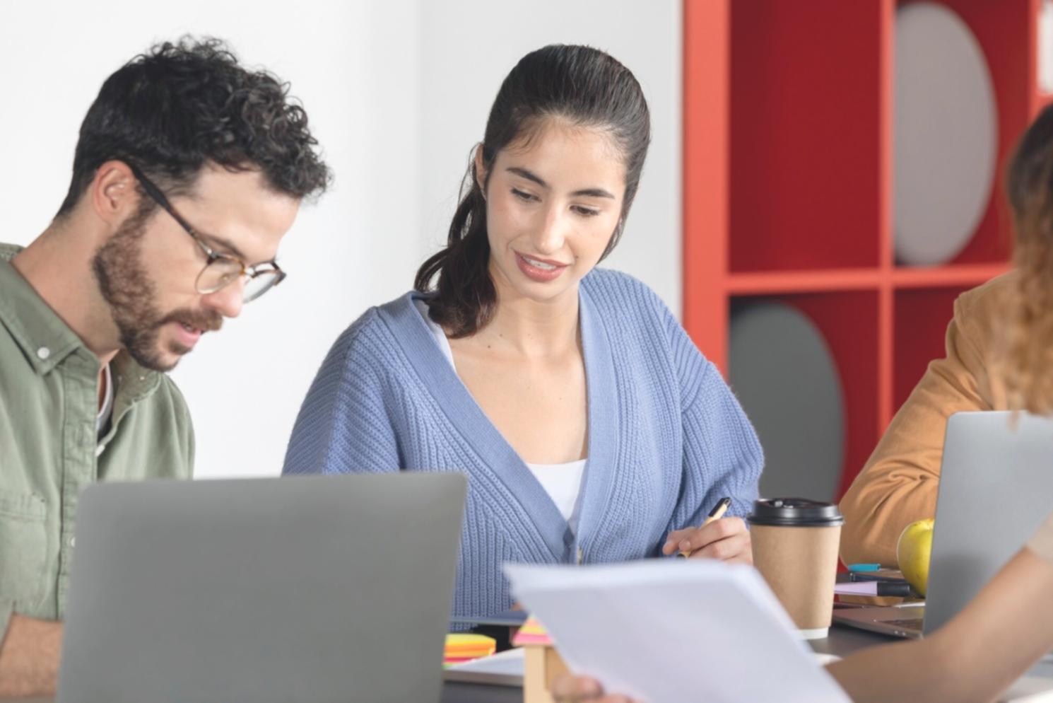 Student reviewing investment portfolio on computer screen